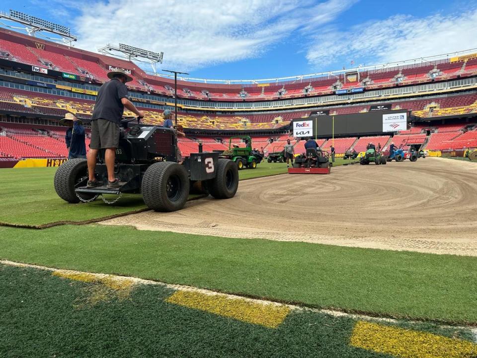 Carolina Green Corp laying down grass in Commanders field, home of the Washington Commanders.