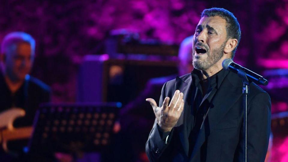 An image of Iraqi singer Kadim al-Sahir performing at at the International Festival of Carthage at the Carthage Roman Theatre on the outskirts of Tunis, the capital of Tunisia on 3 August 2024.