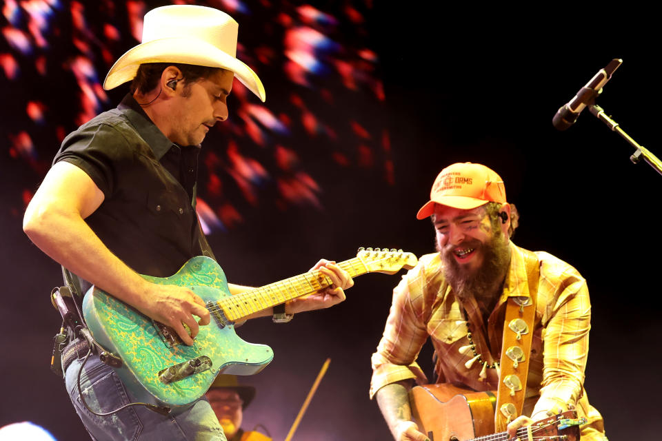 Brad Paisley and Malone perform onstage.