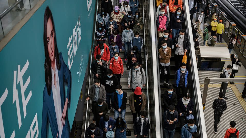 Commuters head to the subway platform during rush hour in Beijing in spring 2020. - Kevin Frayer/Getty Images