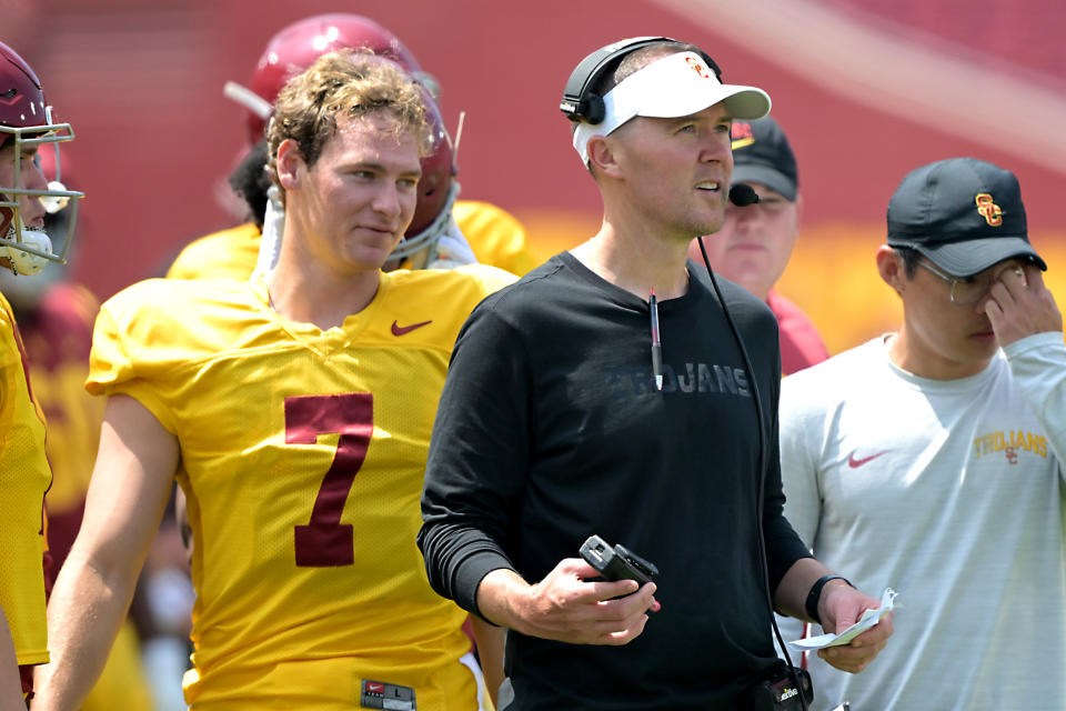 LOS ANGELES, CALIFORNIA - APRIL 20: Miller Moss #7 of the USC Trojans talks with head coach Lincoln Riley during the Spring football game at United Airlines Field at the Los Angeles Memorial Coliseum on April 20, 2024 in Los Angeles, California. (Photo by Jayne Kamin-Oncea/Getty Images)