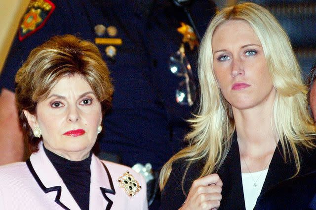 <p>Paul Sakuma-Pool/Getty</p> Attorney Gloria Allred leaves the courtroom with her client Amber Frey after Frey was questioned by attorney Mark Geragos during the Scott Peterson trial August 24, 2004 in Redwood City, California