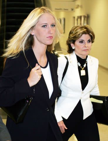 <p>Lou Dematteis-Pool/Getty</p> Amber Frey leaves the San Mateo County Courthouse flanked by her lawyer Gloria Allred after Frey's second day of testimony in the Scott Peterson double murder trial on August 11, 2004 in San Mateo, California