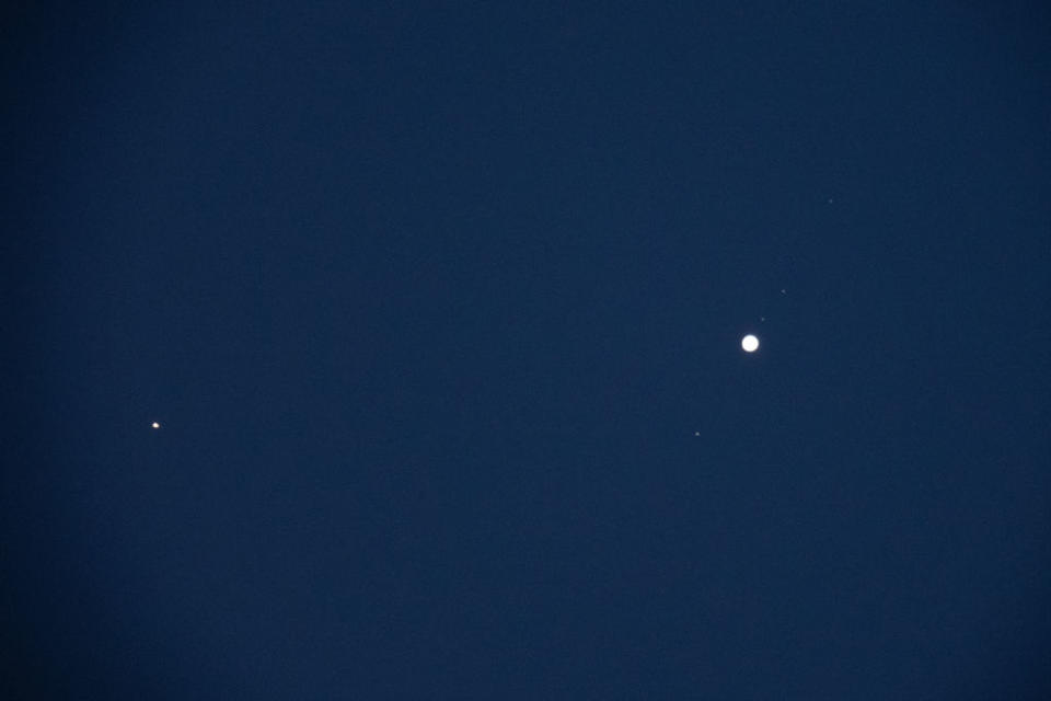 jupiter is the bright dot on the right and mars the bright small dot to the left.