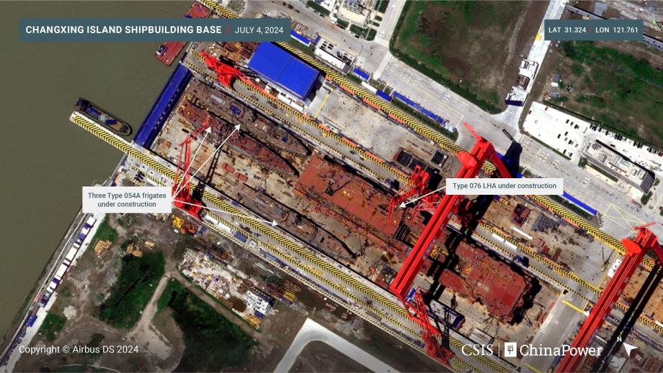 A satellite image shows China's new amphibious assault ship being built alongside other vessels.