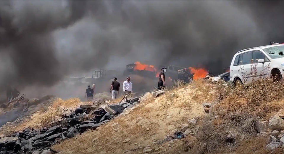 Fires burn in the West Bank village of Burqa after settler attacks on June 7, 2024. (NBC News)