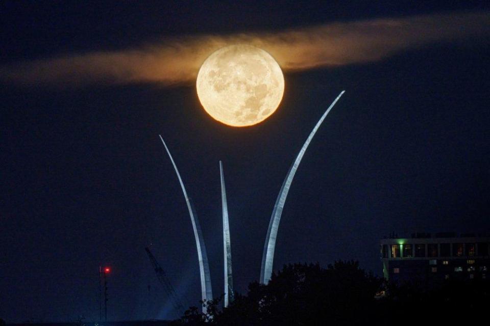 The full Super Blue Moon is centered in the spires of the U.S. Air Force Memorial early in the morning on August 19, 2024 in Arlington, Virginia. / Credit: David Ake/Getty Images