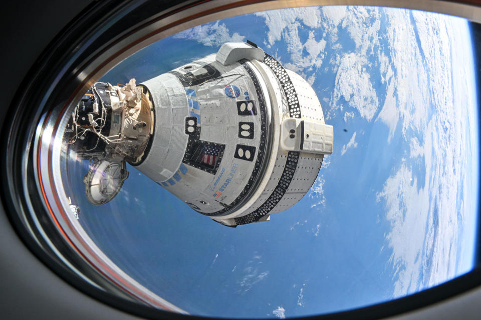 Boeing's Starliner commercial crew ship, docked at the forward port of the International Space Station, will attempt an automated return to Earth as early as Sept. 6, leaving its two-person crew behind on the lab because of concerns about earlier helium leaks and thruster issues.  / Credit: NASA