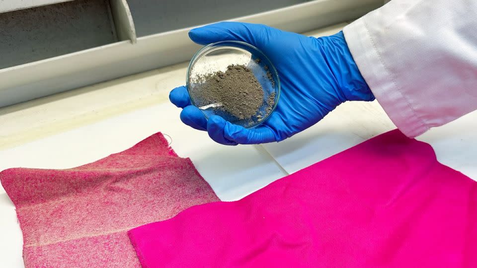 A sample of the treated fabric (L) used in RMIT University's study, next to a sample of untreated fabric (R), with a researcher holding dish of nanodiamonds. - Cherry Cai/RMIT University