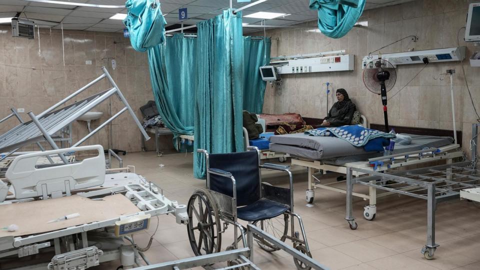 PHOTO: A woman sits on a bed in a room of the Al-Aqsa Martyrs hospital in Deir al Balah, Gaza Strip, Aug. 25, 2024. (Abdel Kareem Hana/AP)