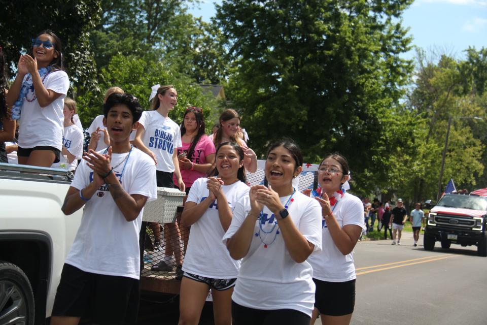 Perry High School cheerleaders participate in the Fourth of July parade on Thursday, July 4, 2024, in Perry.