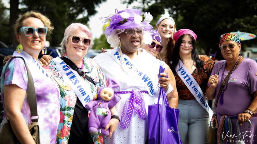 Activist Ms. Darryl Demure (purple hat) has hosted and produced "Harper's Bazzaroworld Presents The Ms. Demure Show" on DATV in Dayton, Ohio, for more than 25 years. It is the nation's oldest LGBTQ+ public access variety talk show.