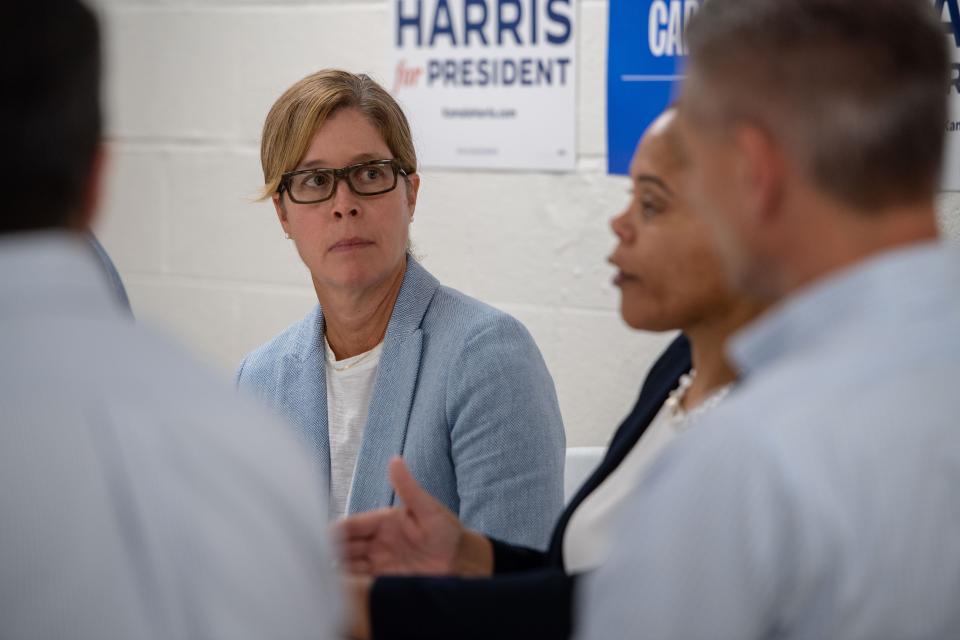 Asheville Mayor Esther Manheimer listens as Monique Pierre, president and CEO of the Housing Authority of Asheville, speaks during a roundtable at the Buncombe County Democratic Headquarters. August 29, 2024.