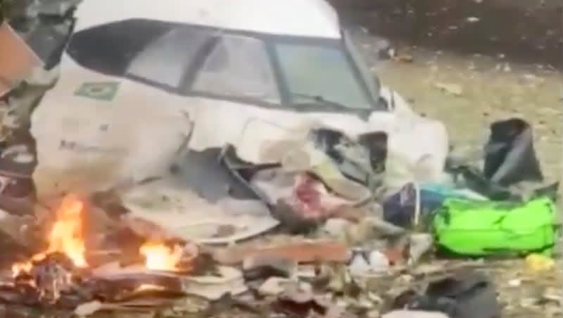 This frame grab from video shows wreckage from a plane that crashed by a home in Vinhedo, Sao Paulo state, Brazil, Friday, Aug. 9, 2024. The plane, which belongs to the airline Voepass Linhas Aeras, departed from Cascavel, Brazil, and was on its way to São Paulo when its signal dropped around 1:30 p.m.