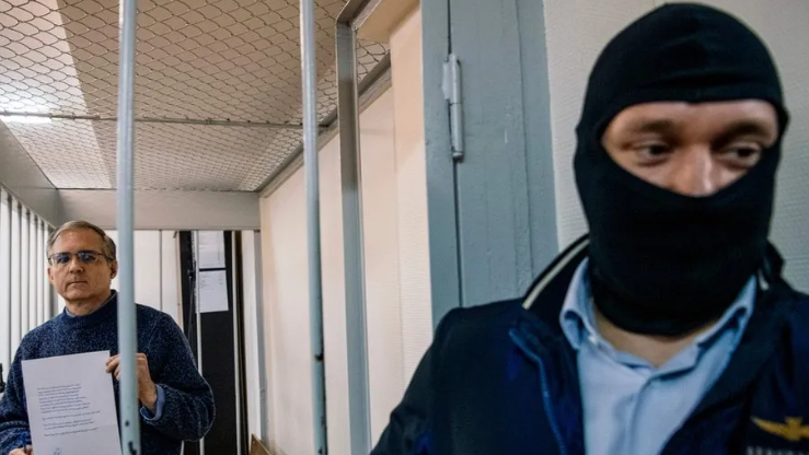 Mr Whelan was guarded in the defendants' cage by a balaclava-clad FSB officer during a court appearance