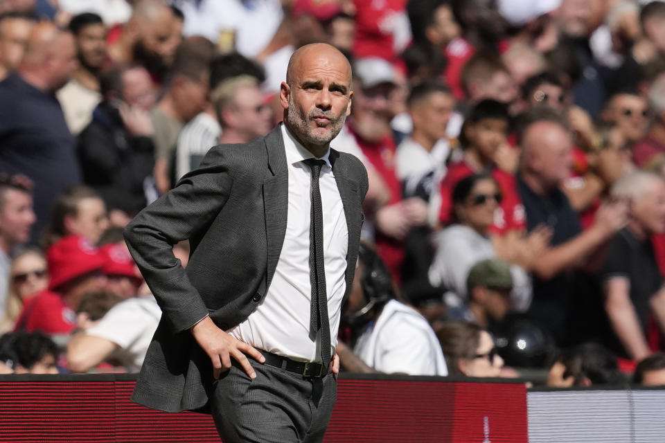 Manchester City coach Pep Guardiola gestures during the English FA Cup final on May 25, 2024. (AP Photo/Kin Cheung)