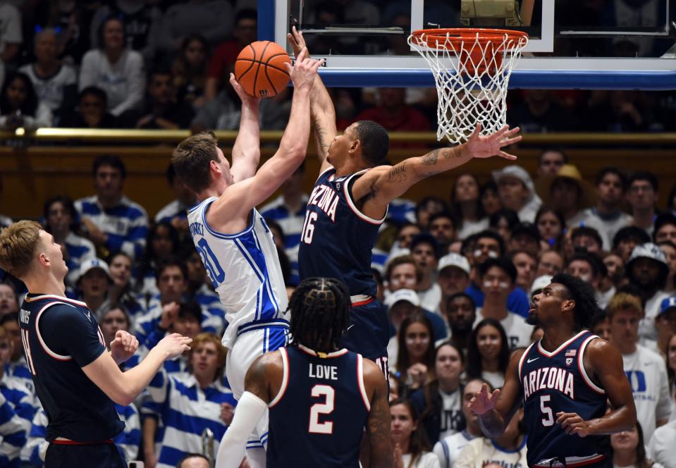 Nov 10, 2023; Durham, North Carolina, USA; Duke Blue Devils center Kyle Filipowski(30) shoots over Arizona Wildcats forward Keshad Johnson (16)during the first half at Cameron Indoor Stadium. Mandatory Credit: Rob Kinnan-USA TODAY Sports