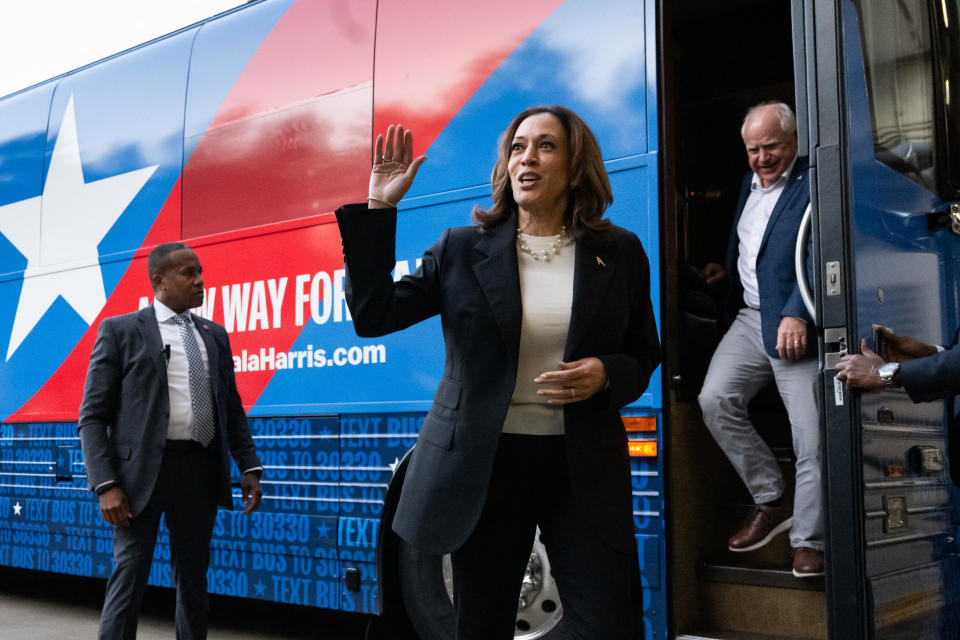 TOPSHOT - Democratic presidential candidate US Vice President Kamala Harris and her running mate, Minnesota Governor Tim Walz, disembark from their campaign bus in Savannah, Georgia, August 28, 2024, as they travel across Georgia for a 2-day campaign bus tour. (Photo by SAUL LOEB / AFP) (Photo by SAUL LOEB/AFP via Getty Images)