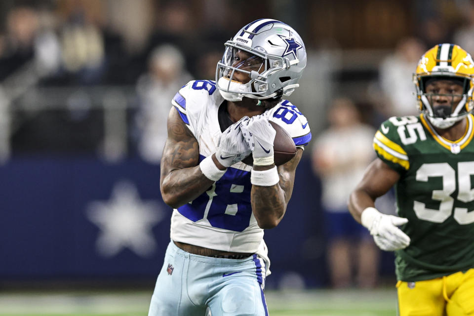 ARLINGTON, TX - JANUARY 14: Dallas Cowboys wide receiver CeeDee Lamb (88) catches a pass for a first down during the NFC Wild Card game between the Dallas Cowboys and the Green Bay Packers on January 14, 2024 at AT&T Stadium in Arlington, Texas. (Photo by Matthew Pearce/Icon Sportswire via Getty Images)