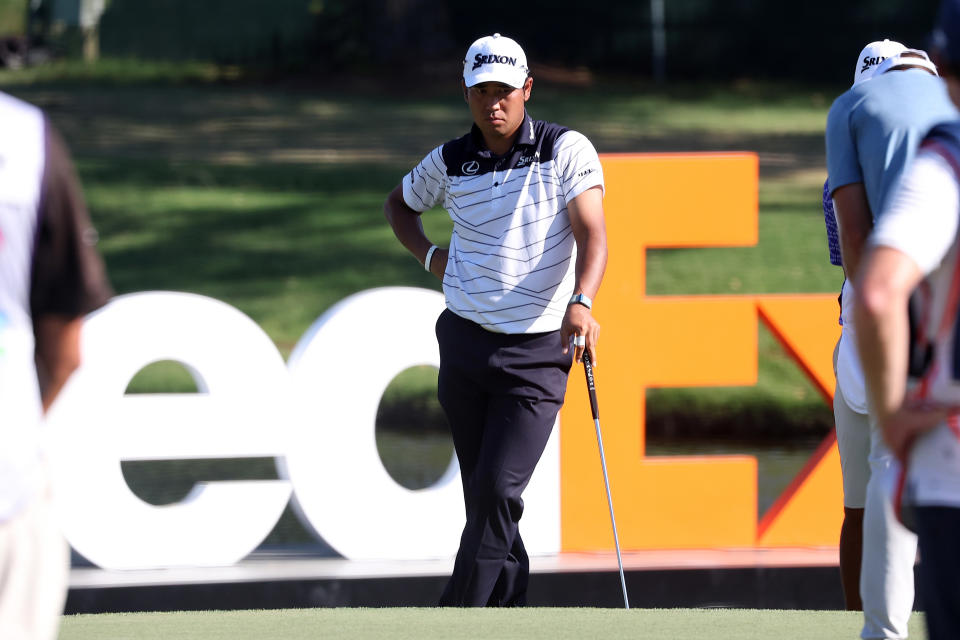 MEMPHIS, TN - AUGUST 17: Hideki Matsuyama (JAP) stands in front of the FedEx sign during the third round of the 2024 FedEx St. Jude Championship on August 17, 2024 at TPC Southwind in Memphis, Tennessee.  (Photo by Michael Wade/Icon Sportswire via Getty Images)