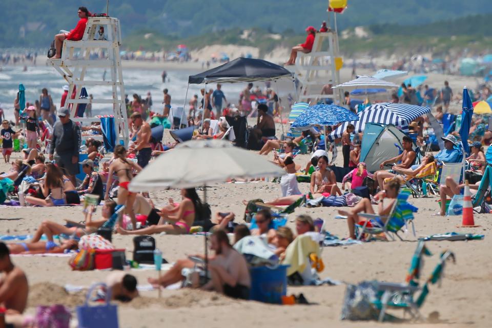 People seek shelter from the extreme heat at Horseneck Beach in Westport.