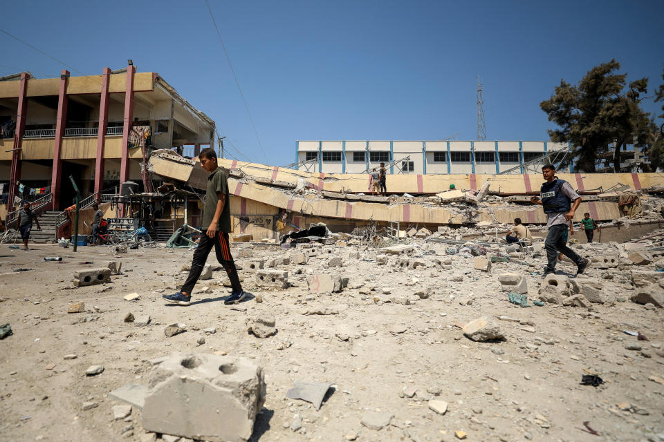 Palestinians inspect a school sheltering displaced people after it was hit by an Israeli strike, amid the Israel-Hamas conflict, in Gaza City, Aug. 20, 2024. / Credit: Dawoud Abu Alkas/REUTERS