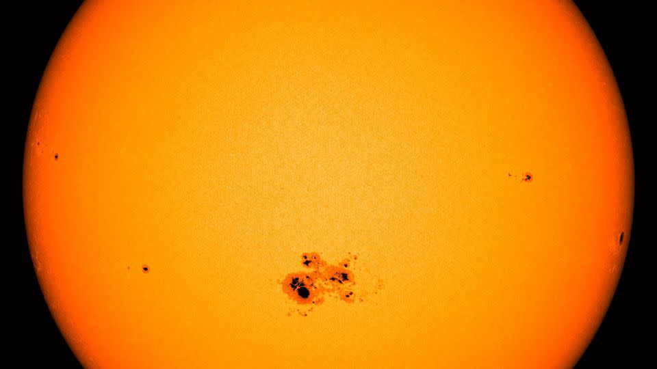 A cluster of sunspots appears on the surface of the sun on October 18, 2014. - NASA Goddard