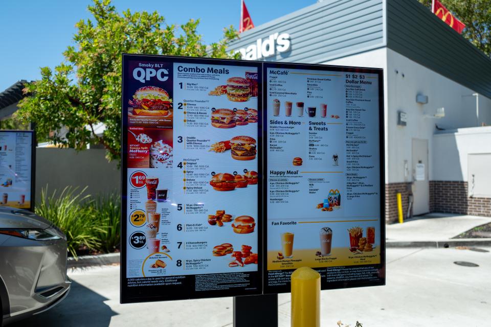 Computerized menu screen, building, McDonald's logo, and front of a vehicle are visible at McDonald's drive thru in San Ramon, California, August 3, 2024. (Photo by Smith Collection/Gado/Getty Images)