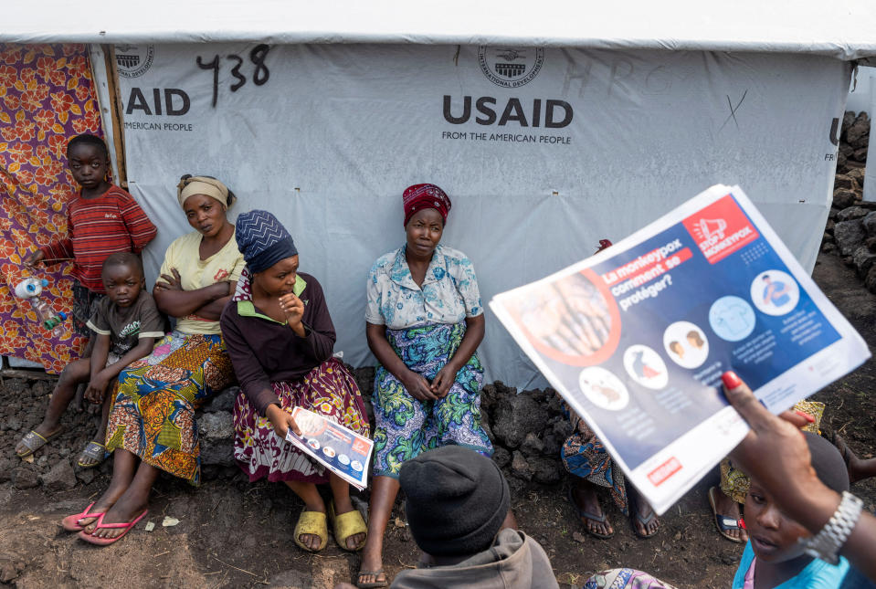 Internally displaced women listen to Nathalie Kipenzi, a hygiene promoter, during an awareness campaign for mpox, an infectious disease that causes a painful rash, enlarged lymph nodes and fever, at the Muja camp for the internally displaced in Nyiragongo territory, near Goma in North Kivu province, Democratic Republic of Congo, Aug. 19, 2024. / Credit: Arlette Bashizi/REUTERS