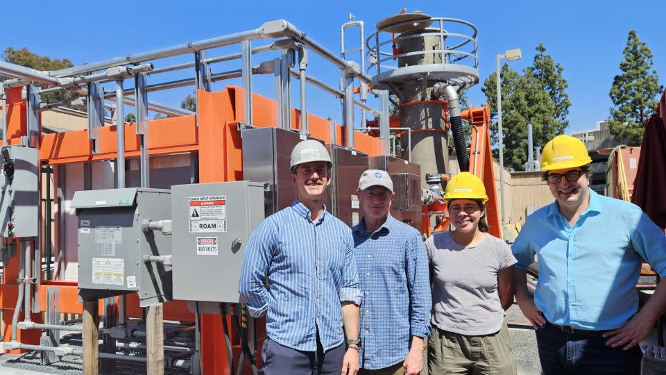 Calcarea founders Pierre Forin, Will Berelson, Melissa Gutierrez and Jess Adkins stand in front of a prototype reactor called Ripple 1 at the University of Southern California. - Pierre Forin