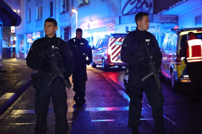 Police and ambulances stand near the scene, where people were killed and injured in an attack at the 650th anniversary celebrations of the city of Solingen in western Germany Gianni Gattus/dpa