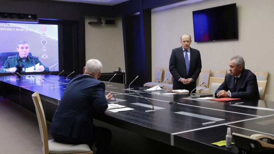 Pool photograph distributed by Russian state owned Sputnik agency, Russia's Defence Minister Andrei Belousov (2nd L) and director of the Federal Security Service (FSB) of the Russian Federation, Alexander Bortnikov (3rd L) along with the Secretary of the Security Council of the Russian Federation, Sergei Shoigu listen to Chief of the General Staff of the Armed Forces of the Russian Federation, Valery Gerasimov (L) seen on a screen as he remotely joins a meeting with heads of law enforcement agencies to address the situation in the Kursk region, in Moscow, on August 7, 2024.