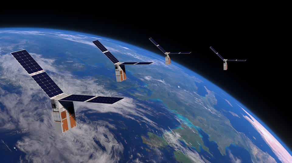  A visualization of Earth with four identical solar-winged satellites in orbit. 