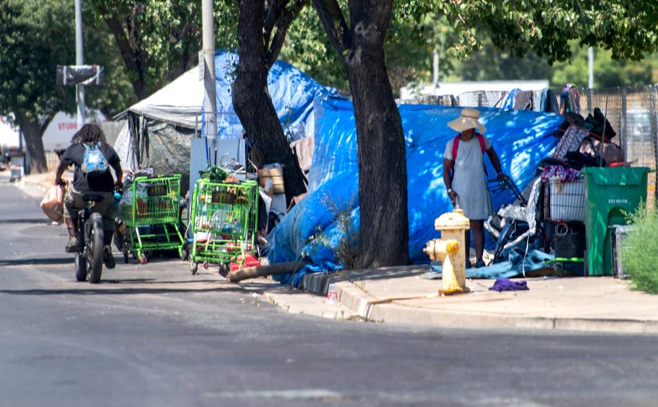 A homeless encampment is set up on the sidewalk on Washington Street near Madison Street in downtown Stockton on Jul. 3. 2024.