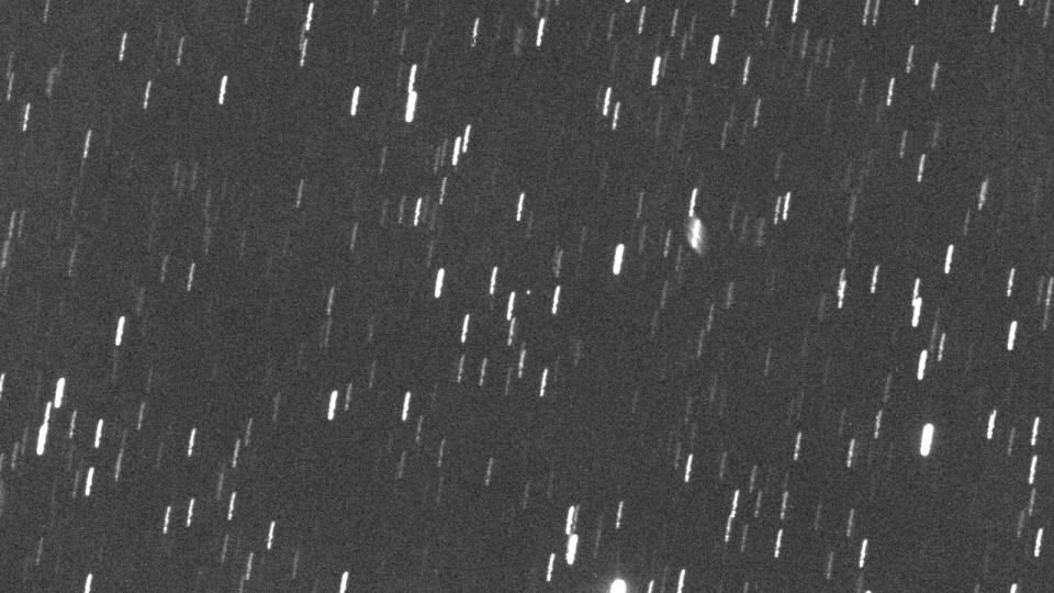  A white dot visible among blurry star streaks. 