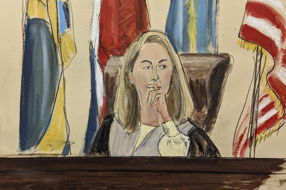 In this courtroom sketch, Chancery Court Chief Judge Kathaleen McCormick listens to testimony in a Wilmington, Del., courtroom on Monday, Nov. 14, 2022, where Tesla shareholders are challenging a compensation plan for CEO Elon Musk potentially worth more than $55 billion. (Elizabeth Williams via AP)