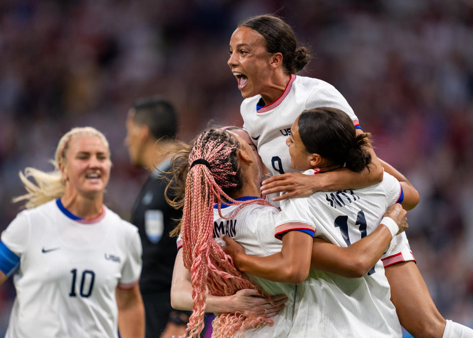 MARSEILLE, FRANCE - JULY 28: Trinity Rodman #5, Mallory Swanson #9 and Sophia Smith #11 of the United States celebrate a goal during the Women's Group B match between Germany and USWNT during the Olympic Game Paris 2024 at Stade de Marseille on July 28, 2024 in Marseille, France. (Photo by Brad Smith/ISI/Getty Images).