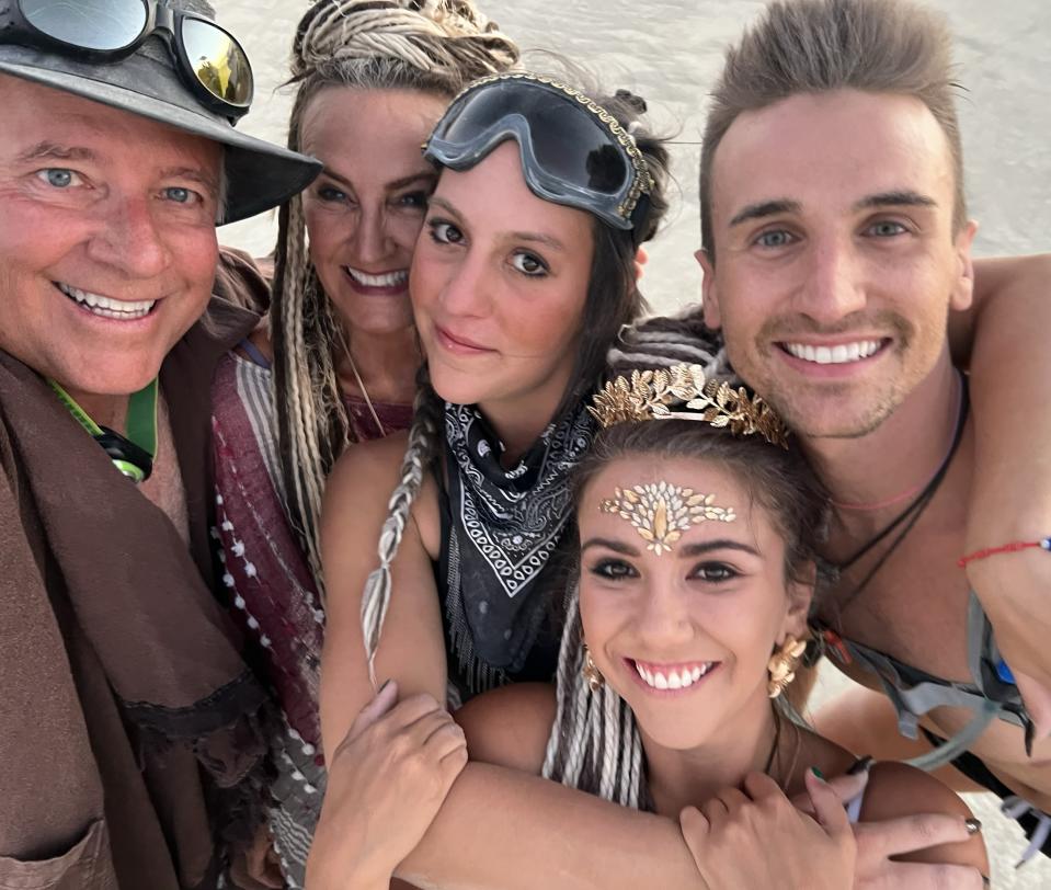 Greg Holden, left, at Burning Man last year with his wife, Louise, friend Giovana, niece Rebecca and son Gatlin.