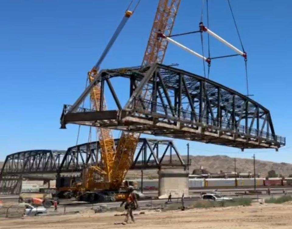 It was an emotional day as a massive crane began lifting portions of the historic Barstow First Avenue Bridge off its foundation as part of the demolition process.