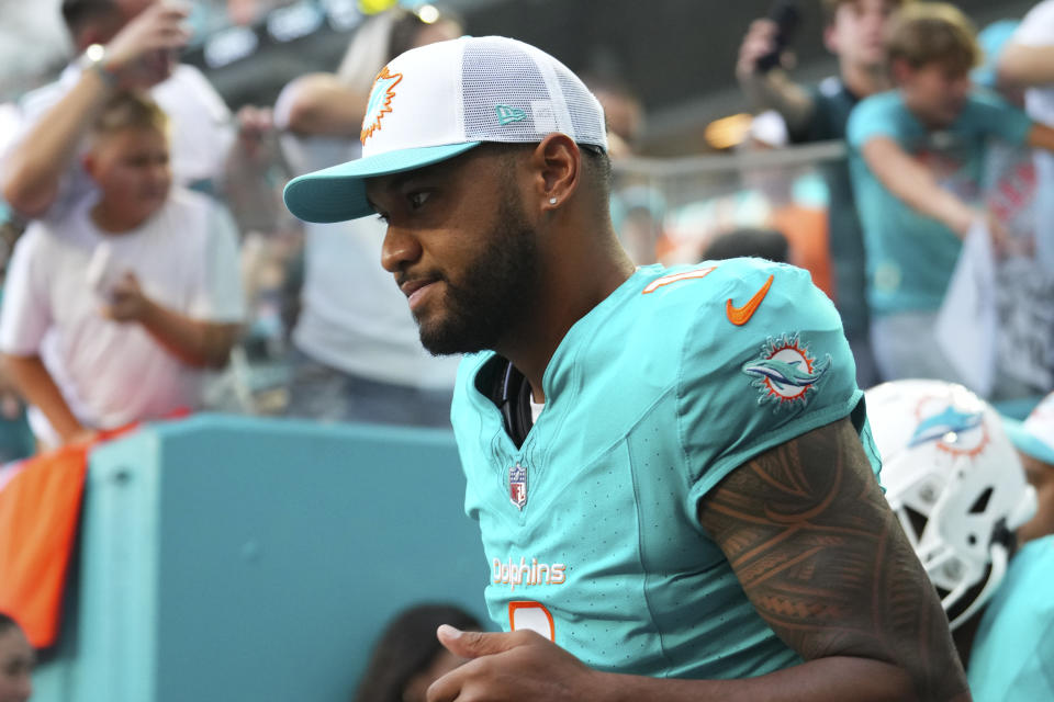 MIAMI GARDENS, FLORIDA - AUGUST 17: Tua Tagovailoa #1 of the Miami Dolphins enters the field prior to a preseason game against the Washington Commanders at Hard Rock Stadium on August 17, 2024 in Miami Gardens, Florida.  (Photo by Rich Storry/Getty Images)