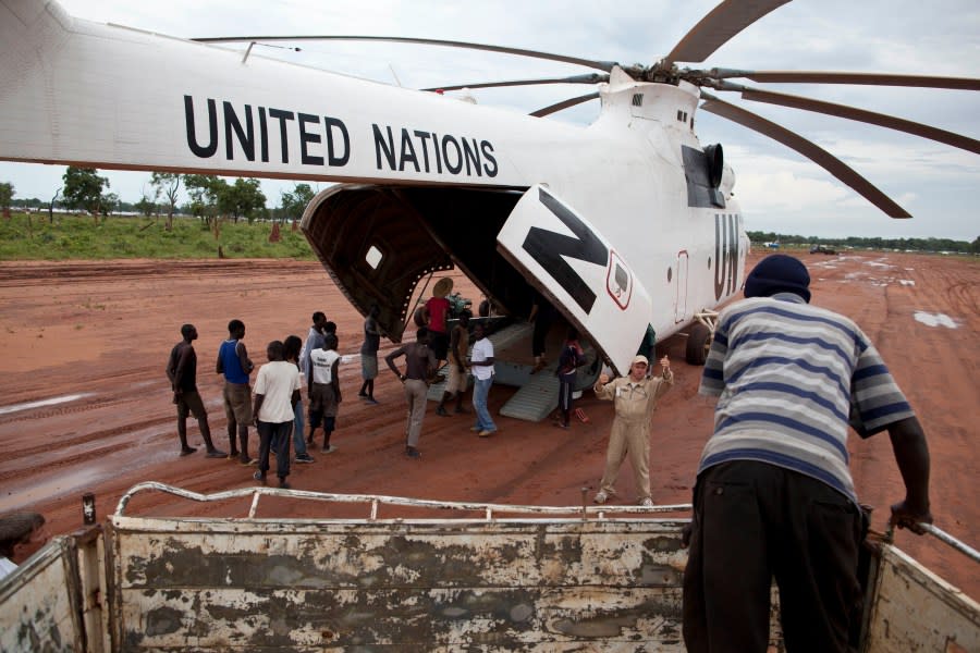 FILE -A World Food Programme (WFP) truck backs up to load food items from a recently landed UN helicopter, in Yida camp, South Sudan Sept. 14, 2012. (AP Photo/Mackenzie Knowles-Coursin), File)