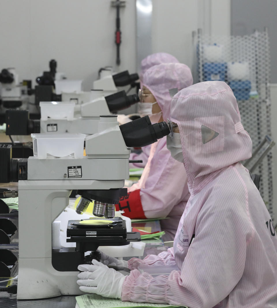 HUAI'AN, CHINA - APRIL 29, 2024 - A worker produces chips for mobile phones, cars, LED lighting at a workshop in Huai 'an city, Jiangsu province, China, April 29, 2024. (Photo by Costfoto/NurPhoto via Getty Images)