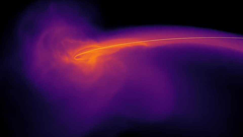  A orange swirl at the heart of a purple cloud of gas. 