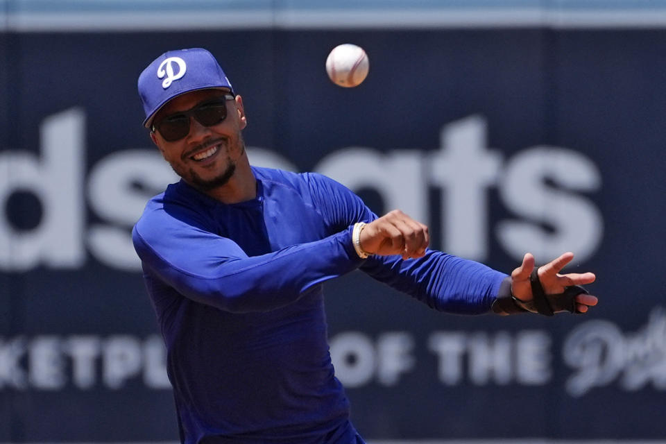 Los Angeles Dodgers' Mookie Betts works out prior to a baseball game against the Milwaukee Brewers Saturday, July 6, 2024, in Los Angeles. (AP Photo/Mark J. Terrill)