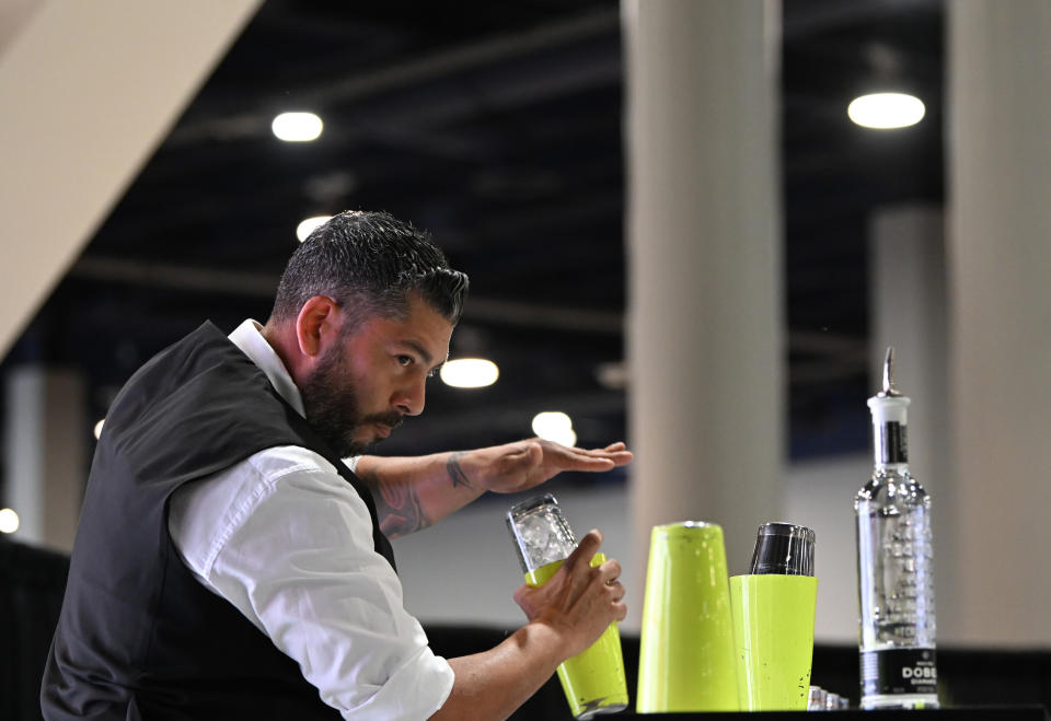 LAS VEGAS, NEVADA - MARCH 20: Manny Picon Delgado demonstrates flare bartending onstage during the United States Bartenders Guild Shake it Up Championship during day 3 of the 2024 Bar & Restaurant Expo at the Las Vegas Convention Center on March 20, 2024 in Las Vegas, Nevada. (Photo by Bryan Steffy/Getty Images for Nightclub & Bar Media Group)