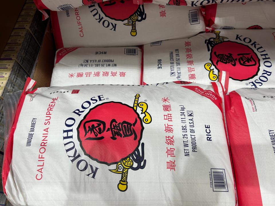 Bags of 25-pound Kokuho Rose California premium rice at Costco.