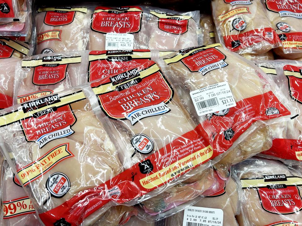 Kirkland Signature boneless and skinless chicken breasts in the refrigerated section at Costco.