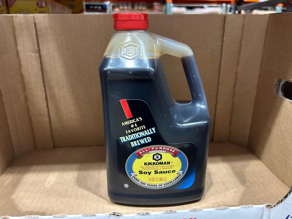 A bottle of Kikkoman soy sauce in a box at Costco.