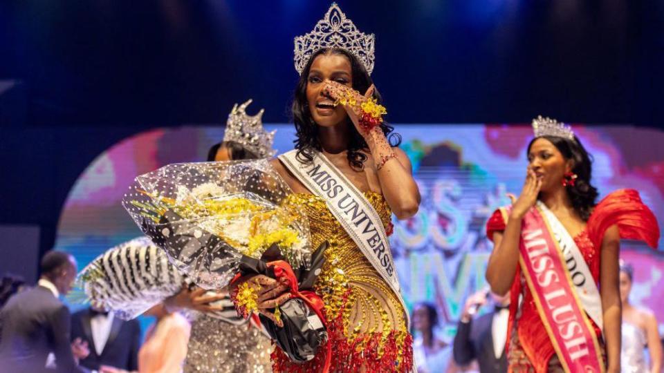 Chidimma Adetshina, the winner of Miss Universe Nigeria, holding a bouquet of flowers and wearing a large crown in Lagos, Nigeria - Saturday 31 August 2024