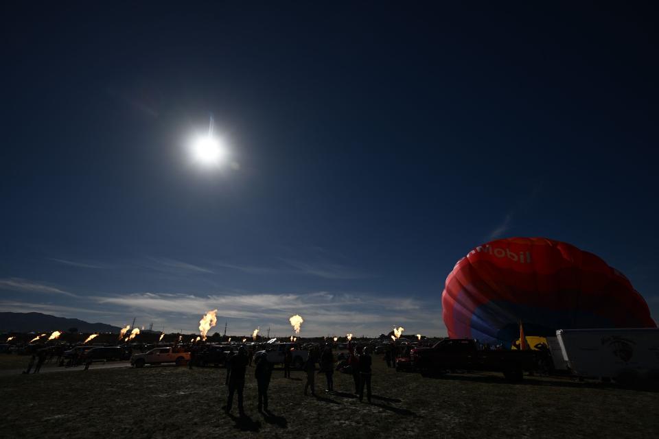 the sky darkens to a dusky dark blue during a solar eclipse